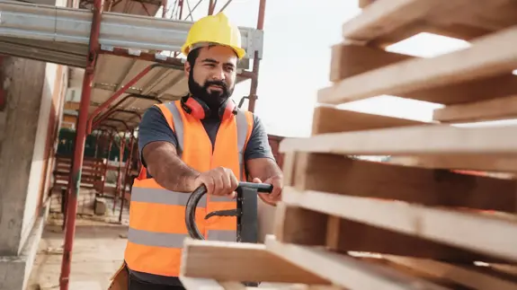 Construction Worker Pushing Pallet